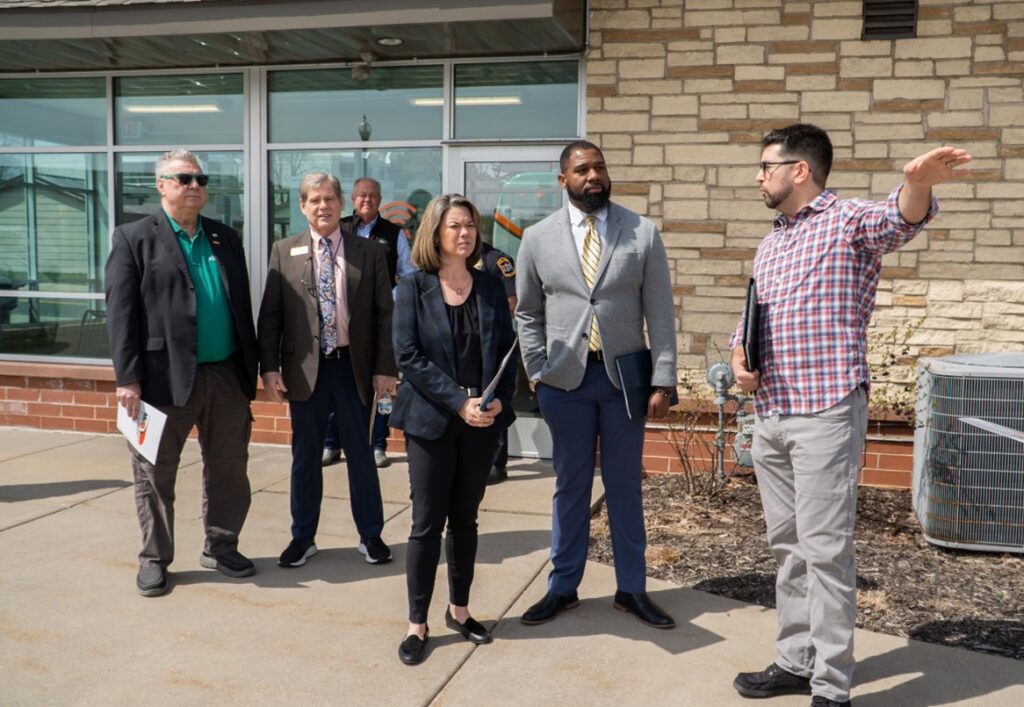 Anthony Taylor, MVTA Manager, Infrastructure and Capital Projects, discusses plans for improvements at Rosemount Transit Station with, from left, x; Dan Kealey, Chair of the MVTA Board of Commissioners, Y; U.S. Rep. Angie Craig, and MVTA Chief Executive Officer Luther Wynder. 